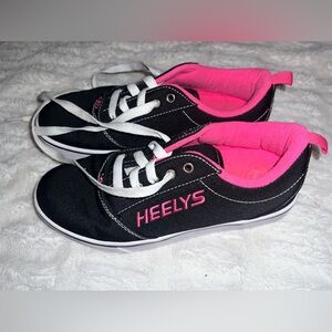 Size 7 women’s heely’s black and pink shoes with roller on them. Walk & skate